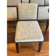 a set of four upholstered dining chairs