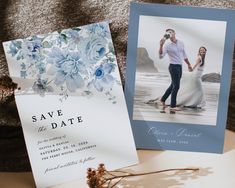 two wedding cards with flowers on them next to an envelope that says save the date