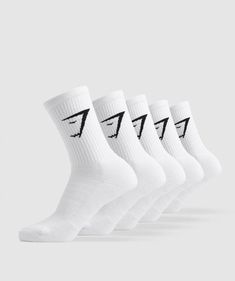 EASY WEAR; EASY PERFORMANCE. The Gymshark Crew Socks provide comfort, cushioning and contouring with a mix of reinforced stretch and ribbing and a flattering fit to the calf. You can be sure you’ll step with support and step with style, from treadmill to sidewalk. - 5 pairs per pack- High crew sock fit- Rib from mid-foot to calf- Birds eye stretch material to foot- Terry Knit to heel and toe for cushioning- Cuffed rib- Jacquard sharkhead logos to side- 69% Cotton, 28% Nylon, 3% Elastane- US Men’ Gym Shark Socks, Gymshark Socks, Shark Socks, Burr Basket, Shopping Wishlist, Neutrogena Makeup, Old Outfits, Wishlist 2024, Gym Ideas