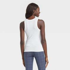 Keep your casual look simple yet chic with this 2-Piece Slim Fit Ribbed Bundle Tank Top from A New Day™. These below-waist tank tops in a solid color make a versatile staple to pair with a range of casualwear. The soft, stretchy fabric offers a comfortable fit, with a rib-knit construction lending a touch of texture and softness. They feature a crew neck and a slim fit to create a sleek silhouette. Pair with jeans, shorts or wide-leg pants to bring versatile style to your everyday attire, and la White Casual Tank Top For Loungewear, Casual White Tank Top For Loungewear, Trendy White Tank Top For Loungewear, Non-stretch Cotton Tops For Daywear, Casual Solid Color Tank Top For Daywear, Casual Stretch Tops For Daywear, Basic White Tank Top For Day Out, White Basic Tank Top For Day Out, Casual Fitted Tank Top For Daywear