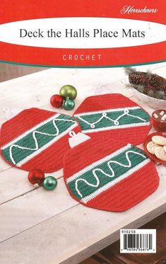 two crocheted christmas place mats on a table