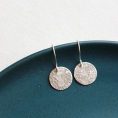 Sweet little discs of shimmering silver.  I have given the metal a "raw silk" texture.  It is subtle and unique.  Discs measure 1/2".  Total length 1".  Handmade shepherd hook earwires.  Sterling silver.  Your jewelry will arrive beautifully gift wrapped in a small box. If this is a gift being shipped directly to the recipient, please let me know. I will be glad to include a note from you.Want to see more of my work? Click here to return to my etsy shop: http://www.etsy.com/shop/SDJewelryFollow Teardrop Silver Earrings, Silk Texture, Brown Jewelry, Earrings Everyday, Disc Earrings, Herkimer Diamond, Raw Silk, Metal Jewelry, Handmade Earrings