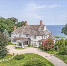 an aerial view of a large white house