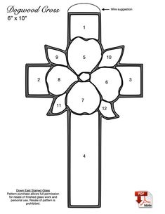 a cross with flowers on it and numbers for each piece in the pattern, as well as