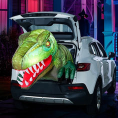 the back end of a car with an inflatable dinosaur head