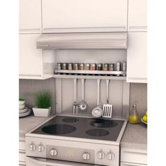 a stove top oven sitting inside of a kitchen next to a wall mounted spice rack