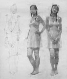 two women standing next to each other in front of a drawing with lines on it