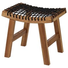 a wooden stool with an intricate design on it