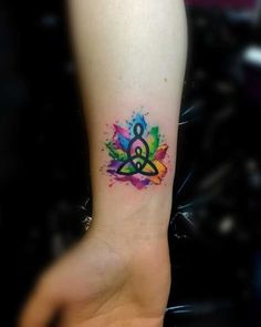 a person with a colorful tattoo on their arm