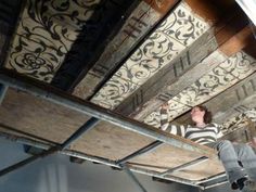 a man riding a skateboard up the side of a wooden ceiling