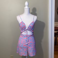 Pink Romper With Blue Flowers And Brand New With Tags. Triangle Tie Front With Elastic Cutout Band. Size Medium. Pink Bottoms Matching Set For Summer, Pink Matching Set Bottoms For Summer, Cute Matching Set Bottoms For Summer, Pink Matching Set Bottoms For Spring, Pink Romper, Pink Rompers, Blue Flowers, Pink Blue, Pant Jumpsuit