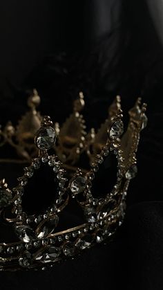 a tiara is shown on a black surface