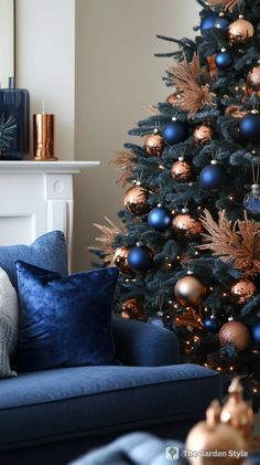 a christmas tree with blue and gold ornaments