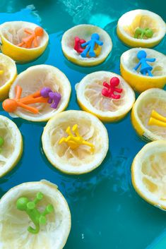 there are lemons with toy figures in them