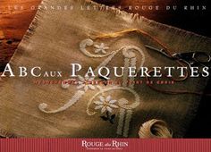 a book cover with an embroidered cloth on top of it and the words abcaux paquettes