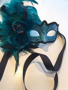 Masks Turquoise mask- feather Masquerade Mask- Mardi Gras Masquerade Mask- Holiday Mask- Halloween -Masked ball -Masquerade party mask Hello, This feather mask is a stunning stopper and is made with turquoise coque feathers are about to 8 inch. They fan out and are placed on a beautiful Green Carnival Masks And Prosthetics, Green Masks For Masquerade Carnival, Green Mask For Masquerade Carnival, Green Masks For Carnival Masquerade, Green Masks For Mardi Gras Carnival, Green Masquerade Mask For Mardi Gras Party, Feathered Masquerade Mask For Carnival Party, Mardi Gras Eye Masquerade Mask For Themed Events, Green Masquerade Mask For Mardi Gras