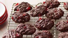 chocolate cookies are cooling on a wire rack