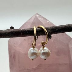 Alexa Creole Earrings with Pearl 22ct Gold Plated on Brass with sterling silver post. Baroque  Freshwater Pearl Drop Handmade in our London studio  Pearls have long been associated with sincerity, loyalty, purity and truth.  Pearls are attuned with the water and moon energies, therefore they aid in connecting with the Goddess and the female side of the self. Take care to avoid extreme humidity or heat as this may cause tarnishing. Your gold vermeil and silver jewelry should be kept in a dark, co Gold Single Pearl Earring In Sterling Silver, Gold Color Sterling Silver Single Pearl Earring, Gold Sterling Silver Earrings With Pearl Drop, Gold Hoop Earrings With Pearl Charm In Sterling Silver, Elegant Nickel-free Teardrop Huggie Earrings, Yellow Gold Huggie Earrings With Pearl Charm As Gift, Gift Yellow Gold Huggie Earrings With Pearl Charm, Elegant Brass Dangle Huggie Earrings, Sterling Silver Yellow Gold Earrings With Pearl Charm