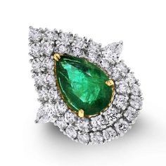 An impressive stated Pear Shape Emerald Ring to capture the attention of and dazzle the onlooker,... Luxury Pear-shaped Diamond Emerald Ring, Luxury Pear-shaped Brilliant Cut Emerald Ring, Luxury Green Marquise Diamond Ring, Luxury Pear-shaped Emerald Ring For Formal Occasions, Luxury Pear-shaped Emerald Ring With Prong Setting, Luxury Marquise Emerald Ring, Elegant Emerald Diamond Pear-shaped Ring, Elegant Gia Certified Pear-shaped Ring, Elegant Pear-shaped Gia Certified Ring