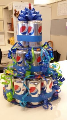 a cake made to look like cans stacked on top of each other with ribbons and bows