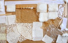 several pieces of paper and lace laid out on a table