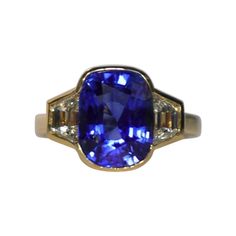 Sapphire Weight: 5.50 ct, Diamond Weight: 1.05 ct (I-VS), Metal: 18K Yellow Gold, Ring Size: 6.5, Shape: Cushion, Color: Blue, Hardness: 9, Birthstone: September, CD Certified Classic Cushion Cut Brilliant Gemstones, Gia Certified Classic Gemstones For Formal Occasions, Classic Gia Certified Gemstones For Formal Occasion, Luxury Formal Gemstones With Bezel Setting, Luxury Gemstones With Bezel Setting For Formal Occasions, Luxury Bezel Set Gemstones For Formal Occasions, Classic Octagon Sapphire Ring, Classic Octagon Gia Certified Gemstones, Classic Sapphire Gemstones With Accent Stones