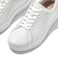 True classics. With clean styling, an old-school 'tennis shoe' shape, and our light flexible Anatomicush™ midsoles, these are the sneakers you can't live without. The ones that'll work with your whole wardrobe – jeans, dresses, tailored suits – season after season. Your go-tos on busy days when comfort is non-negotiable. Life essentials. Softly padded, here in supple leather. Ergonomically engineered to help optimize your body's alignment, natural movement & energy Ultra-light, all-day cushionin Life Essentials, Happy Shoes, Fitflop Shoes, Athleisure Fashion, Leather Trainers, Tailored Suits, Classic Leather, Shoe Care, Trainers Women