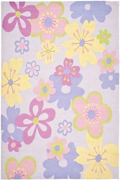 a rug with flowers on it in pink, blue and yellow colors is featured against a white background