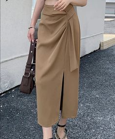 The most elegant attire, perfect for any occasion, is this new skirt. The flattering cut and subtle color palette make it a perfect addition to your wardrobe. Do you wanahavit? Size(cm) Length Waist Hip Thigh S 79 64 / / M 80 68 / / L 81 72 / / XL 82 76 / / *Tips: (1 cm=0.39 inch, 1 inch=2.54 cm) 1. Please strictly follow the size chart. Do not select the size directly according to your habits.2. The size information may have 1-3cm differences due to manual measurement. Korean Long Skirt, Fitted Midi Skirt, Split Hem Skirt, Irregular Skirt, Midi Wrap Skirt, Elegant Attire, Skirts Midi High Waisted, Wrap Around Skirt, Long Skirts For Women