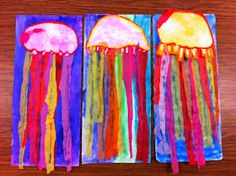 two jellyfish paintings on paper with colored streamers