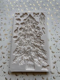 a cookie sheet with a frosted christmas tree on it