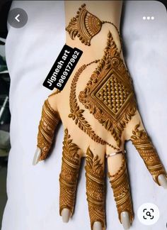 a henna on someone's hand with the tag