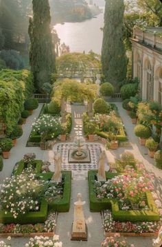 an outdoor garden with lots of flowers and trees