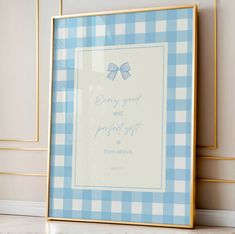 a blue and white checkered frame with a bow on the bottom that says, every good and perfect is from above