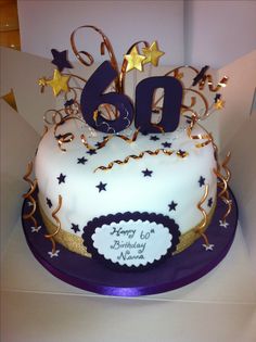 a birthday cake with the number sixty on it and stars in the top tiers