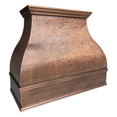 a copper colored stove hood with an ornate design on the top and bottom, shown against a white background