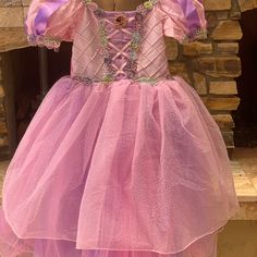 Disney Cruise Line’s From Bibbidi-Bobbidi-Boo Salon “Exclusive” Never Worn. Size 7/8 There Is A Lot Of Give To The Material Around The Chest Area. Is A Bit Itchy So I Recommend Wearing Camisole Underneath. The Pictures Above Is My Daughter Wearing The Same Dress In A Smaller Size. Cute Pink Princess Dress Costume, Purple Princess Dress For Dress-up, Disney Princess Dress For Dress-up, Purple Fairy Dress For Dress-up Occasions, Purple Fairy Style Dress For Dress-up, Purple Fairy Costume Dress, Cute Pink Dress For Role Play, Whimsical Pink Princess Dress For Costume, Purple Princess Fairy Dress For Costume Party