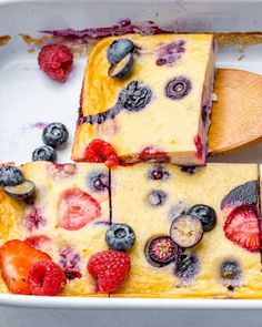 blueberry cheesecake with berries and raspberries in a baking dish, ready to be eaten