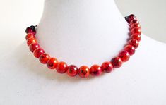 A unique combination of colors in these marbled glass beads! Rust red, orange & green painted on the glass pearl beads, with artisan glass beads on the ends. This necklace measures about 17.25 inches in length (can be shortened), & an extension chain can be added if desired. A very unique & pretty color combo! Adjustable Red Beaded Necklace With 8mm Beads, Adjustable Red Czech Glass Beads, Red Necklaces With Large Czech Glass Beads, Green Paint, Dundee, Beads Necklace, Color Combo, Pretty Colours, Pearl Beads