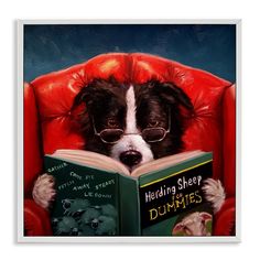 a black and white dog wearing glasses is reading a book while sitting in a red chair