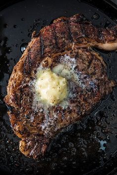 steak with butter and sauce in a skillet