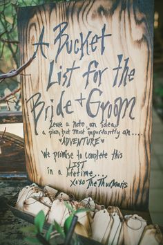 a wooden sign sitting on top of a table