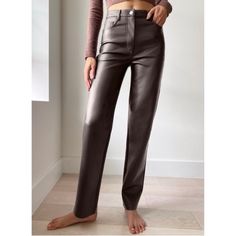 Aritzia Wilfred The Melina Vegan Faux Leather High Rise Pants Mocha Rich Brown Size 14 New With Tags Features: -High Rise -Straight Leg -5 Pocket Style -Soft Sheen -Zip Fly With Tack Button Closure -Topstitch Detailing Throughout -Lined -100% Polyurethane Outer Approximate Measurements When Laid Flat: Waist - 16.25” Rise - 12.25” Inseam - 29.5” Sku 1260 Chocolate Brown Leather Pants, Wilfred Melina Pant, Brown Joggers, Melina Pant, Brown Leather Pants, Wilfred Pants, Tie Waist Pants, Aritzia Pants, Leather Pant