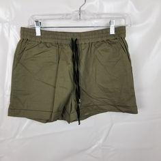 Against Nudity Light Olive Green Cotton Short. Nwt. Tie Style Elastic Waist. Size M Waist - 14 In Across Length 12 In H031 Stretch Khaki Shorts, Sporty Khaki Shorts For Spring, Khaki Drawstring Shorts, Tie Styles, Green Cotton, Cotton Shorts, Olive Green, Elastic Waist, Womens Shorts