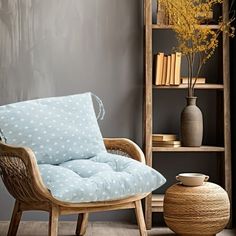 a chair and vase in a room with grey walls