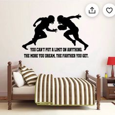 a bedroom with a bed and wall decal that says you can't put a limit on anything the more you dream, the farther you get