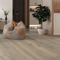 a living room with wood flooring and a bean bag chair in the middle of it