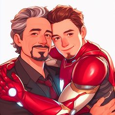 two men are hugging each other and one is wearing a suit with iron man on it