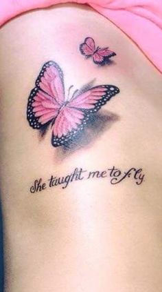 a woman's stomach with two butterflies on it and the words she taught me to fly