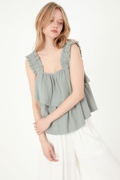 Looking for something special to wear on your next night out? Check out our Ruffled Straps with Tiered Top! This unique top features two tiers of ruffles and ruffle shoulder straps for a stylish, eye,catching look. The elastic at the shoulder straps ensures a comfortable, perfect fit. Made from gauze fabric, this top is sure to keep you cool and comfortable all night long. 2 Tier ruffles Ruffle shoulder straps Elastic at shoulder straps Gauze Hand wash cold Do not bleach Do not tumble dry Iron l Chic Cotton Tops With Ruffled Straps, Summer Tops With Ruffle Hem And Ruffled Straps, Feminine Tops With Ruffle Hem And Ruffled Straps, Trendy Tops With Ruffle Hem And Ruffled Straps, Chic Cotton Ruffled Tank Top, Trendy Cotton Ruffled Tank Top, Trendy Cotton Ruffle Tank Top, Trendy Cotton Tank Top With Ruffles, Summer Tiered Top With Ruffle Hem